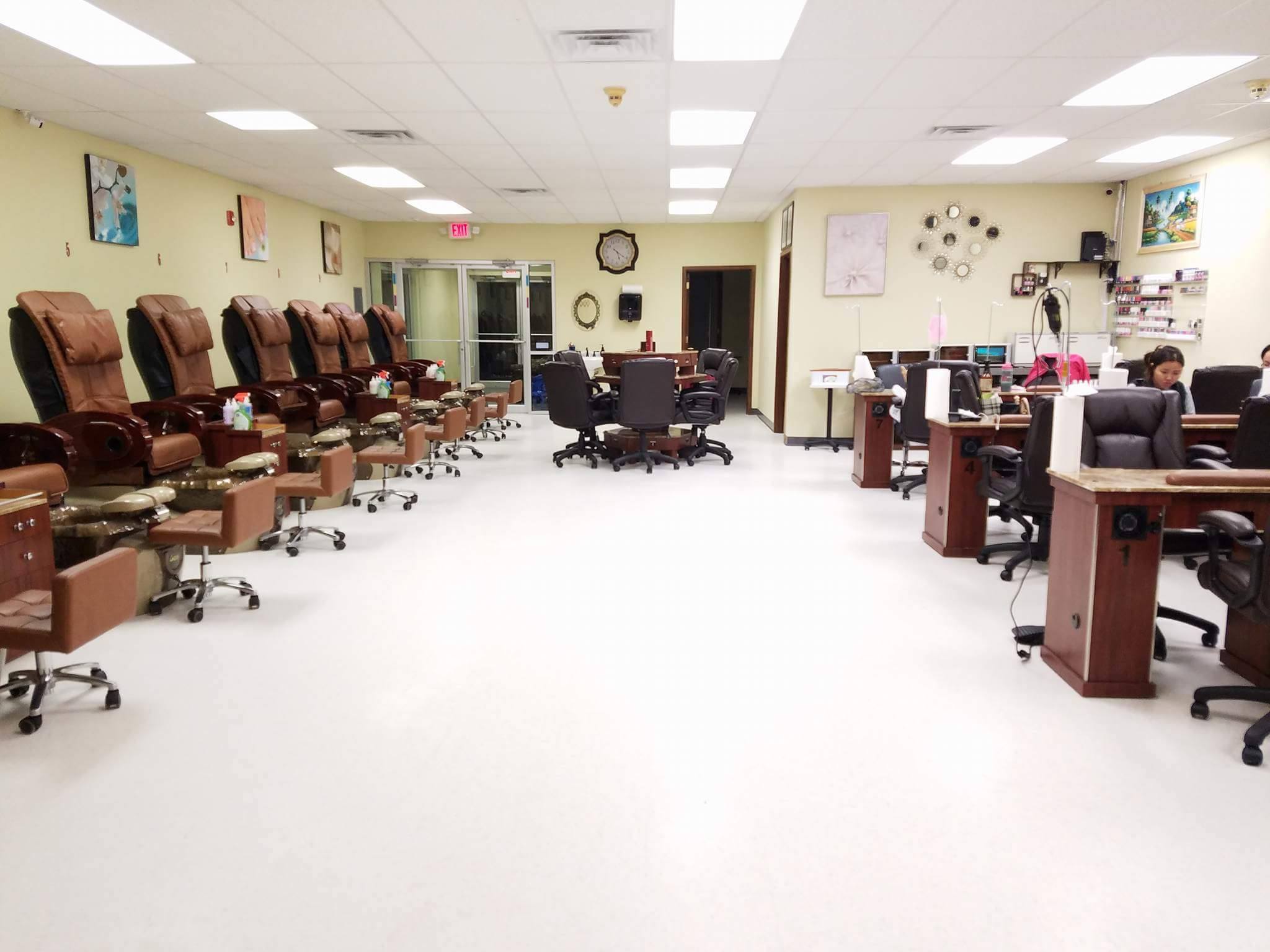 Lima Nails & Spa interior showing clean, modern salon with nail stations and comfortable seating